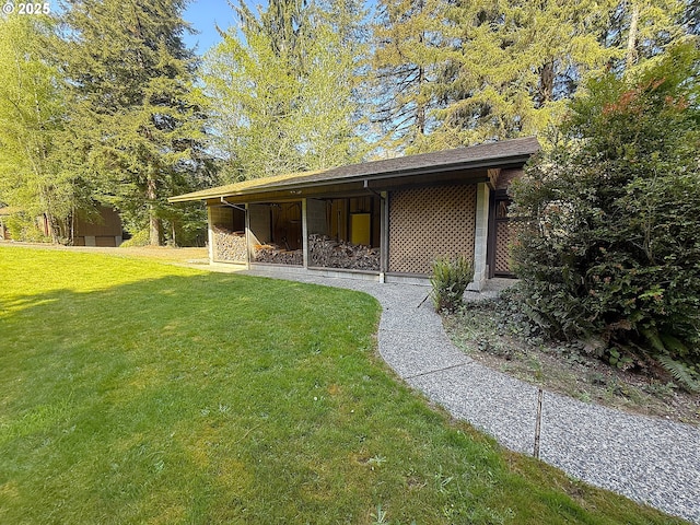 rear view of house with a yard