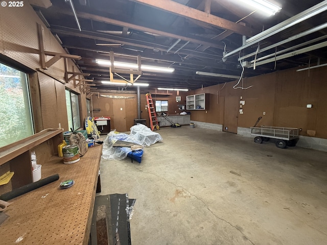 interior space featuring a workshop area, concrete floors, and a garage