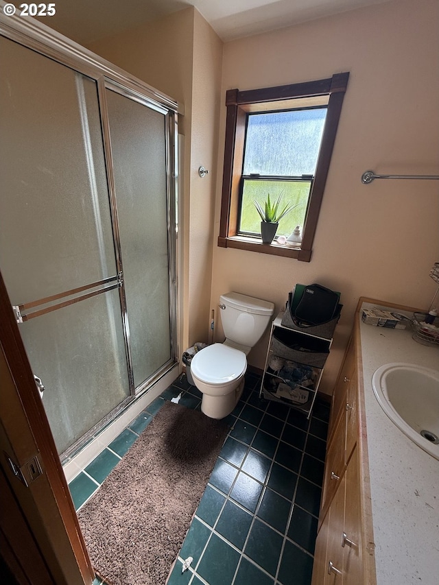 bathroom featuring a stall shower, tile patterned flooring, vanity, and toilet