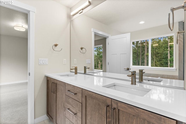 bathroom featuring plenty of natural light and vanity