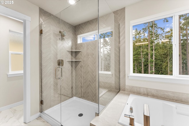 bathroom with shower with separate bathtub