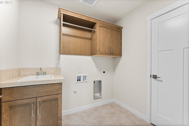 washroom with cabinets, washer hookup, gas dryer hookup, electric dryer hookup, and sink