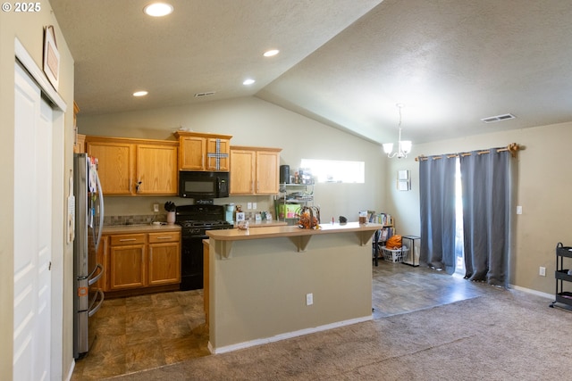 kitchen with a breakfast bar, lofted ceiling, light countertops, visible vents, and black appliances