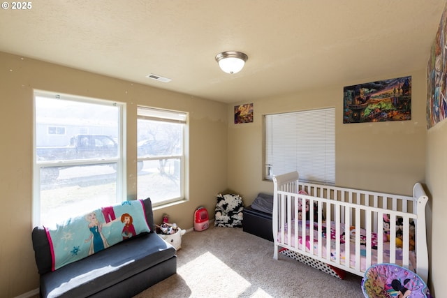 bedroom featuring carpet and visible vents