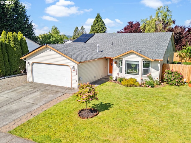 1908 NW 4th Ave, Battle Ground, WA 98604 - view of front of house with a shingled roof, a garage, solar panels, and driveway