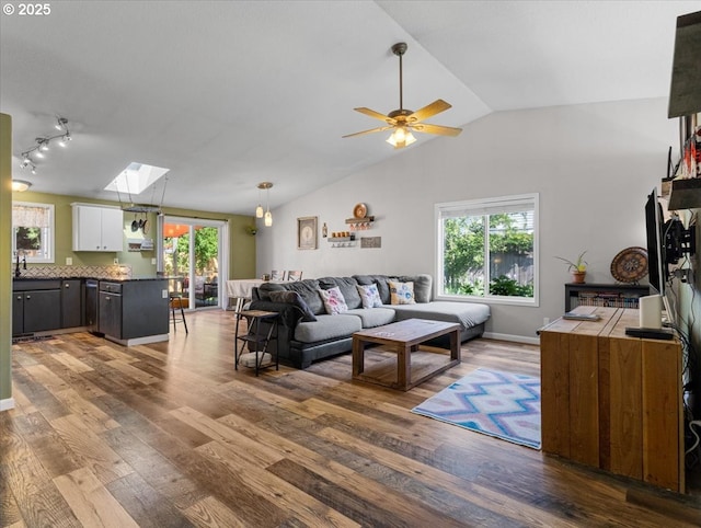 1908 NW 4th Ave, Battle Ground, WA 98604 - living area with vaulted ceiling, a skylight, wood finished floors, and ceiling fan