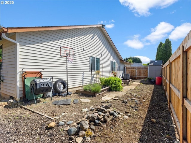 1908 NW 4th Ave, Battle Ground, WA 98604 - view of property exterior with a fenced backyard and central AC