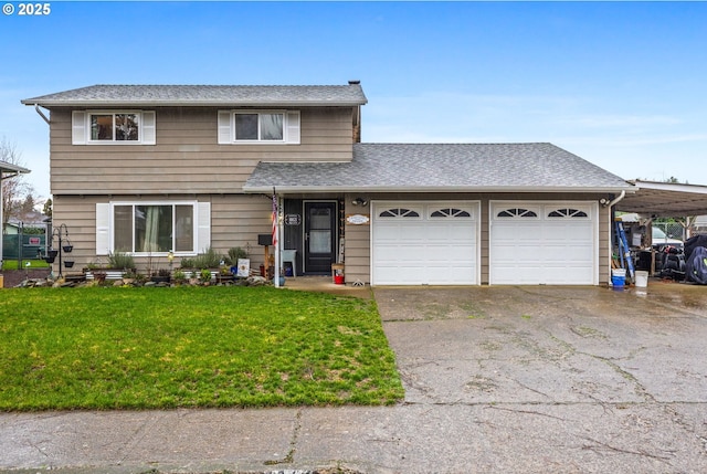 view of front property featuring a garage and a front lawn