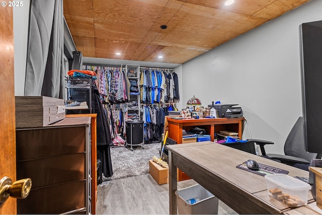 spacious closet featuring light wood-type flooring