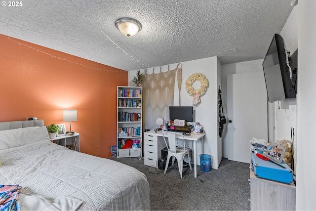 bedroom with dark carpet and a textured ceiling