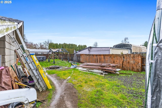 view of yard featuring a fire pit