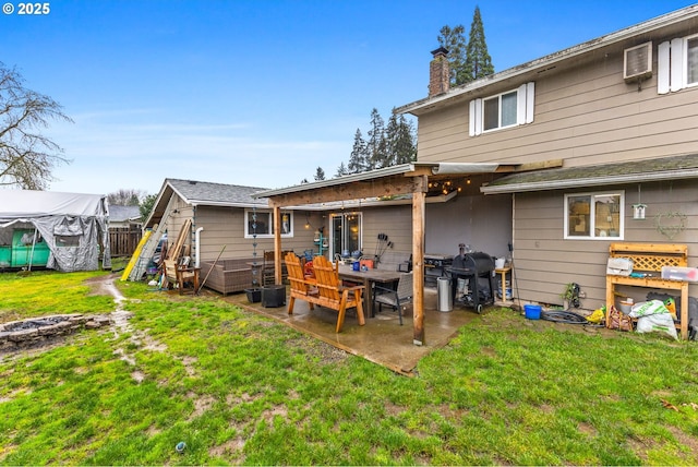 back of house with a playground, a patio, and a yard