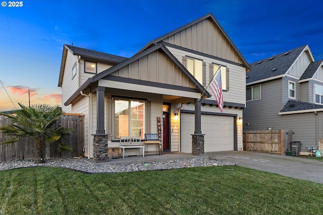 view of front of property with a porch, a garage, and a yard