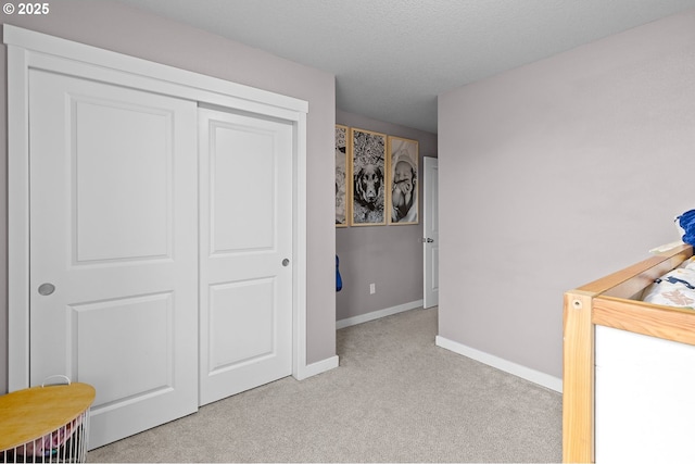 carpeted bedroom featuring a closet