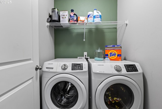 washroom featuring washing machine and dryer