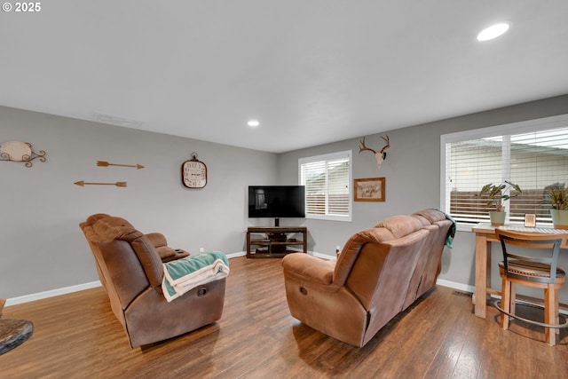 living room with baseboards, wood finished floors, and recessed lighting