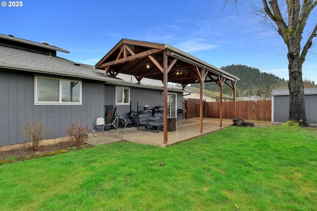 exterior space featuring a gazebo, a patio area, and fence