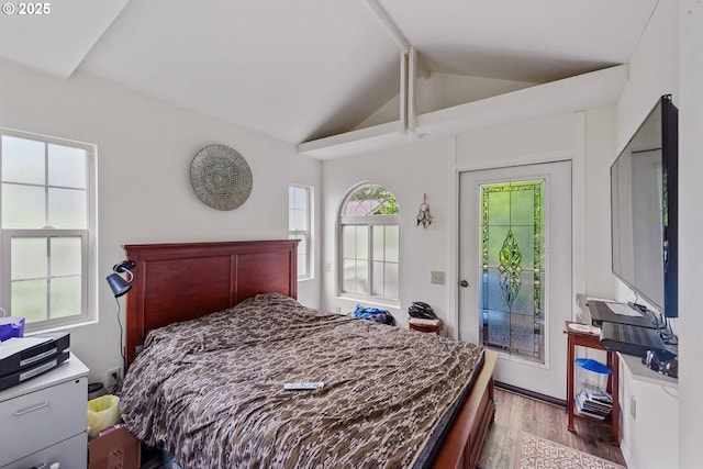 93652 E Blue Bird Ln, North Bend, OR 97459 - bedroom with wood finished floors, lofted ceiling, multiple windows, and access to exterior