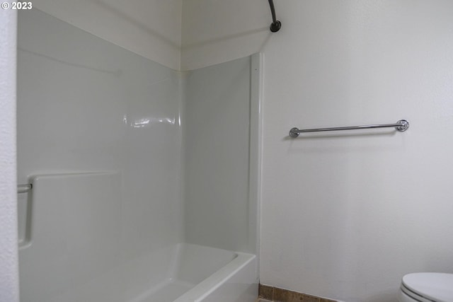 full bathroom featuring toilet and walk in shower