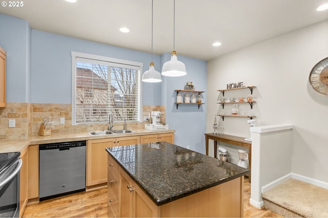 kitchen featuring stainless steel appliances, light brown cabinets, a sink, and tasteful backsplash