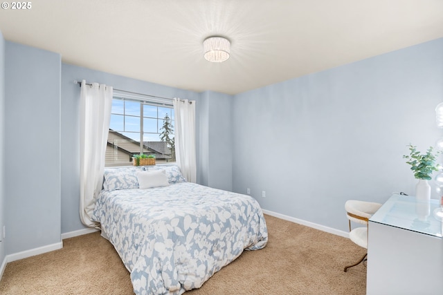 bedroom with carpet and baseboards