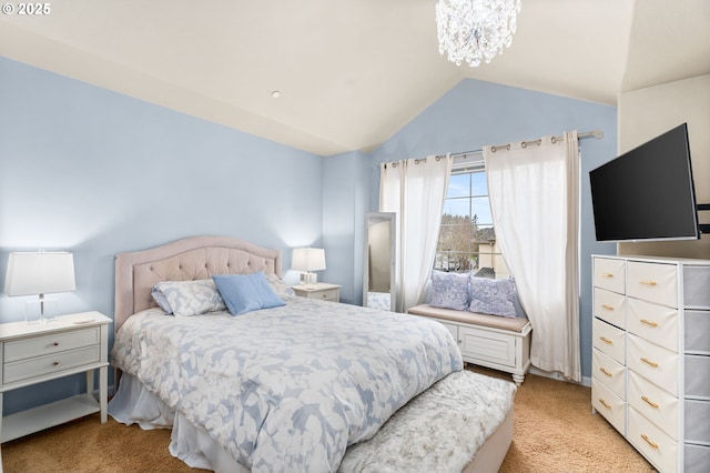 bedroom with a chandelier, vaulted ceiling, and light colored carpet