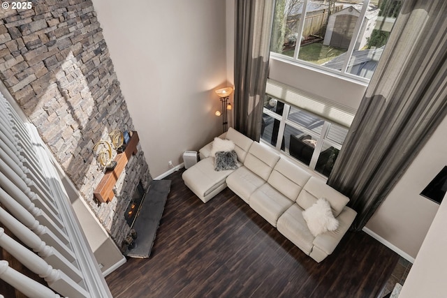 656 Ironwood Ter, Woodburn, OR 97071 - living room with baseboards, wood finished floors, and a lit fireplace