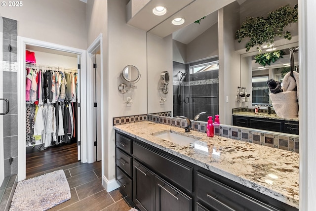 656 Ironwood Ter, Woodburn, OR 97071 - full bathroom featuring baseboards, a spacious closet, a shower stall, recessed lighting, and vanity