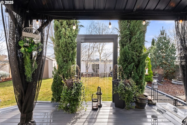 656 Ironwood Ter, Woodburn, OR 97071 - wooden deck with an outbuilding, fence, a storage shed, and a lawn