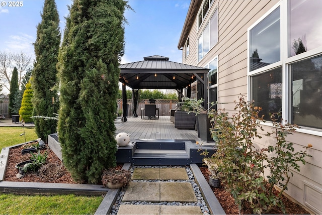 view of patio / terrace with a wooden deck and a gazebo