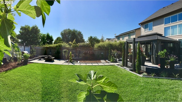 656 Ironwood Ter, Woodburn, OR 97071 - view of yard featuring a gazebo, a patio, fence, and an outdoor fire pit
