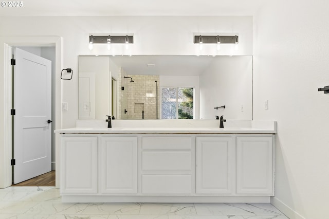 bathroom with vanity and an enclosed shower