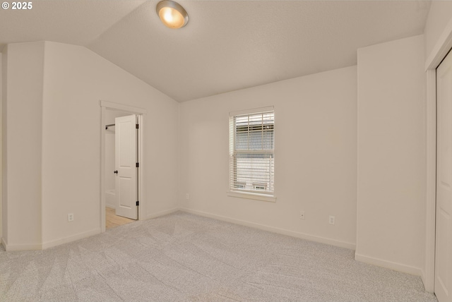608 NE Adwick Dr, Beaverton, OR 97006 - carpeted empty room with lofted ceiling and baseboards