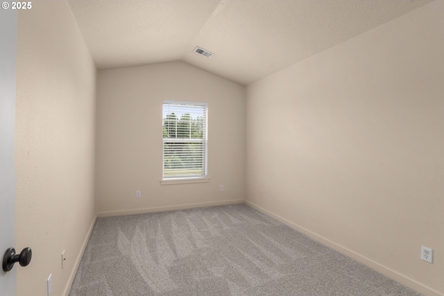 608 NE Adwick Dr, Beaverton, OR 97006 - empty room featuring light carpet and vaulted ceiling