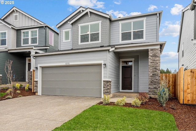 craftsman house featuring a garage, stone siding, concrete driveway, and fence