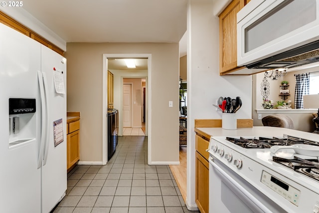 1278 Winery Ln, Eugene, OR 97404 - kitchen featuring white appliances, light tile patterned floors, light countertops, and baseboards