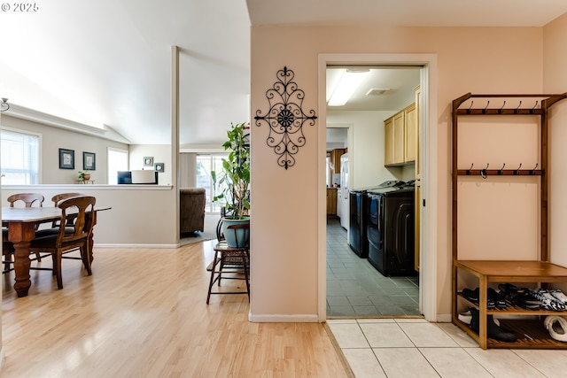 1278 Winery Ln, Eugene, OR 97404 - hallway featuring washing machine and dryer, light wood-style flooring, and baseboards