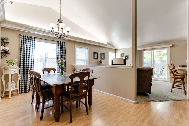 1278 Winery Ln, Eugene, OR 97404 - dining room featuring lofted ceiling, a chandelier, light wood-style floors, and baseboards
