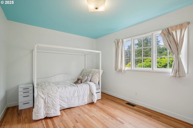 4242 SW Admiral St, Portland, OR 97221 - bedroom with baseboards and wood finished floors