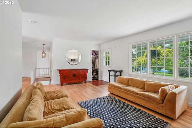 4242 SW Admiral St, Portland, OR 97221 - living room featuring light wood finished floors and baseboards