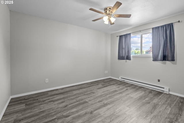 4004 Ginkgo Ave, Tillamook, OR 97141 - empty room with a baseboard radiator, wood finished floors, ceiling fan, and baseboards