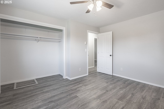 4004 Ginkgo Ave, Tillamook, OR 97141 - unfurnished bedroom featuring wood finished floors, baseboards, a closet, and ceiling fan