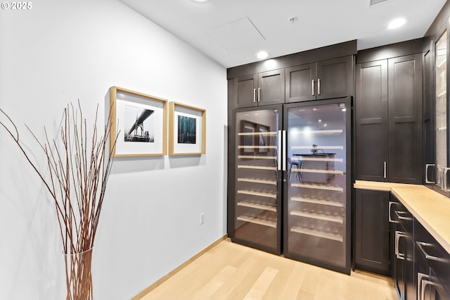 700 Washington St Unit 925, Vancouver, WA 98660 - bar area featuring light wood finished floors, beverage cooler, baseboards, and recessed lighting