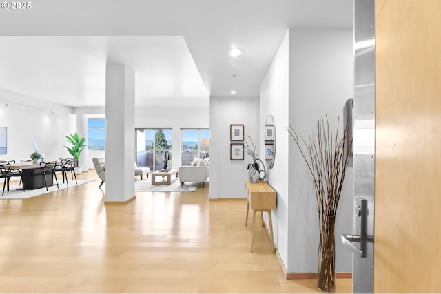 700 Washington St Unit 925, Vancouver, WA 98660 - hallway featuring recessed lighting, light wood-style floors, and baseboards