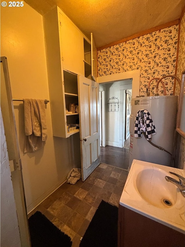 bathroom featuring vanity and gas water heater