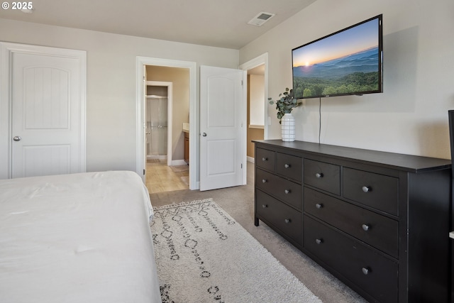 bedroom featuring connected bathroom