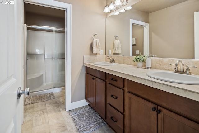 bathroom with vanity and an enclosed shower