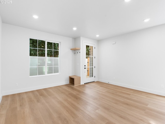 spare room with light hardwood / wood-style flooring