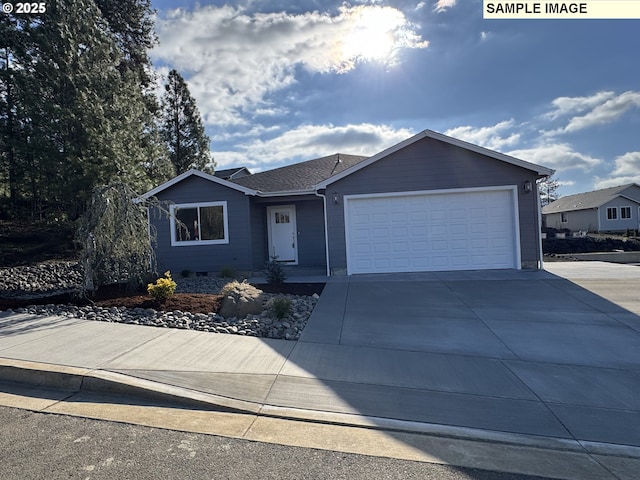 ranch-style home with a shingled roof, concrete driveway, and an attached garage