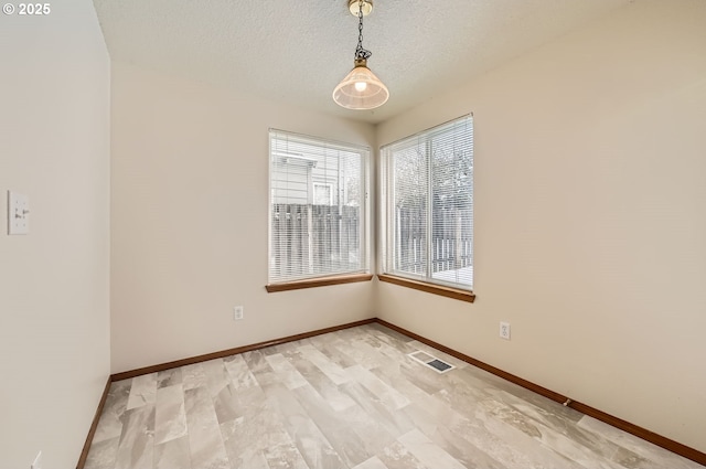 empty room with a textured ceiling